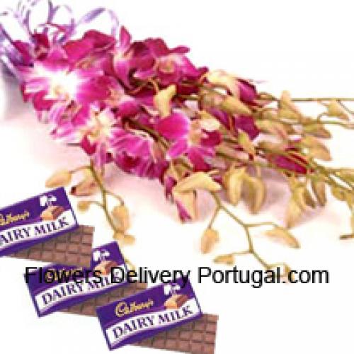 Lindas orquídeas rosadas con chocolates Cadbury